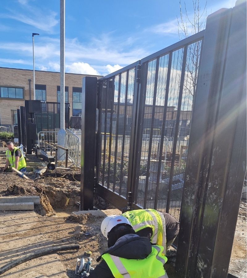 Industrial Gates and Barrier Systems gate installation engineer on site — specialist gate and barrier engineers serving London, Hertfordshire and South East England.